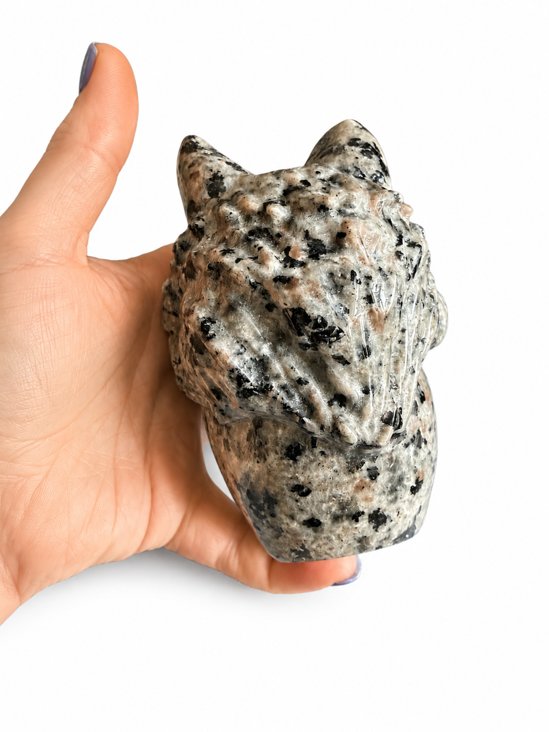 Yooperlite natural crystal skull with wolf on its head carving