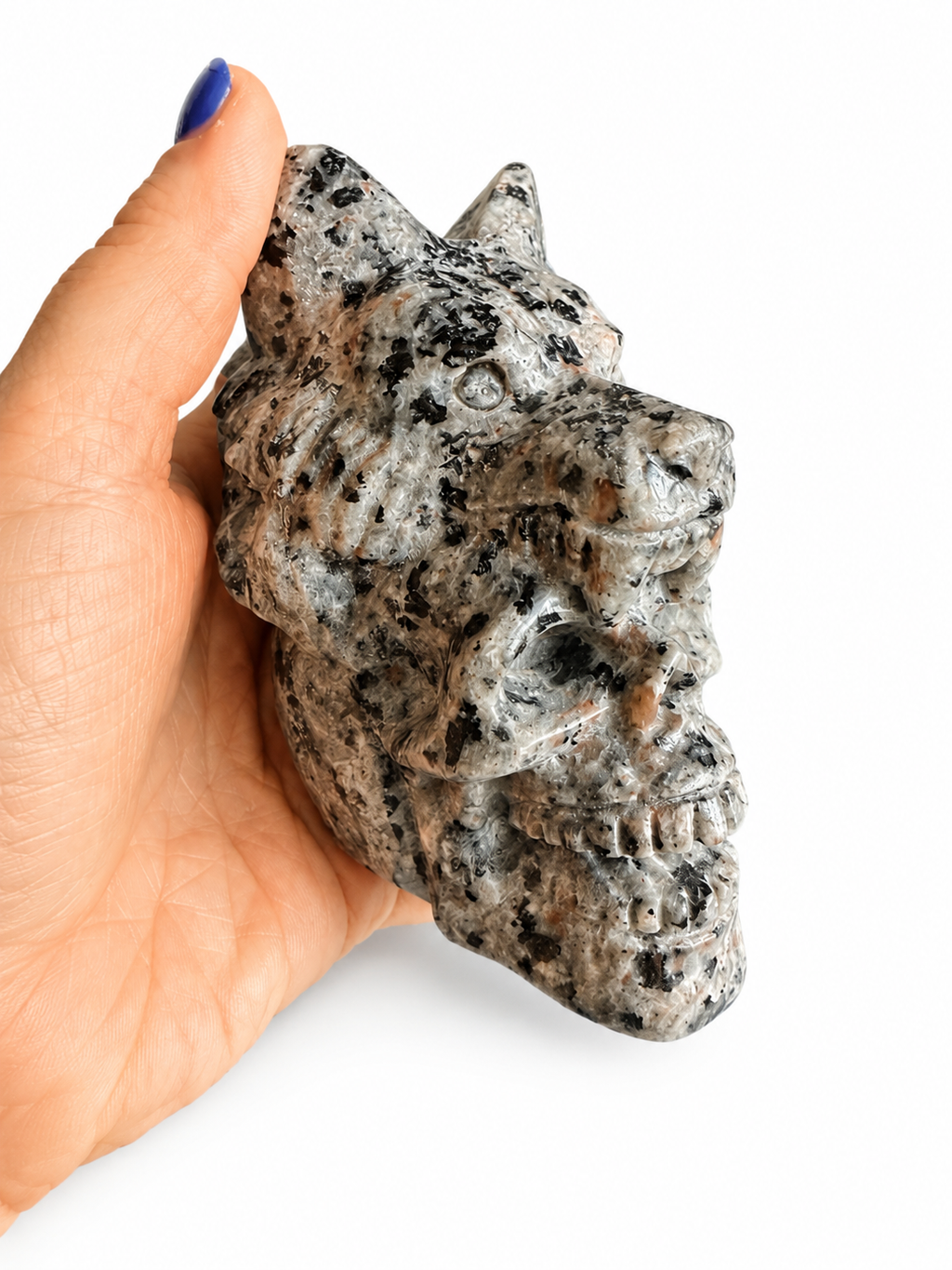 Yooperlite natural crystal skull with wolf on its head carving