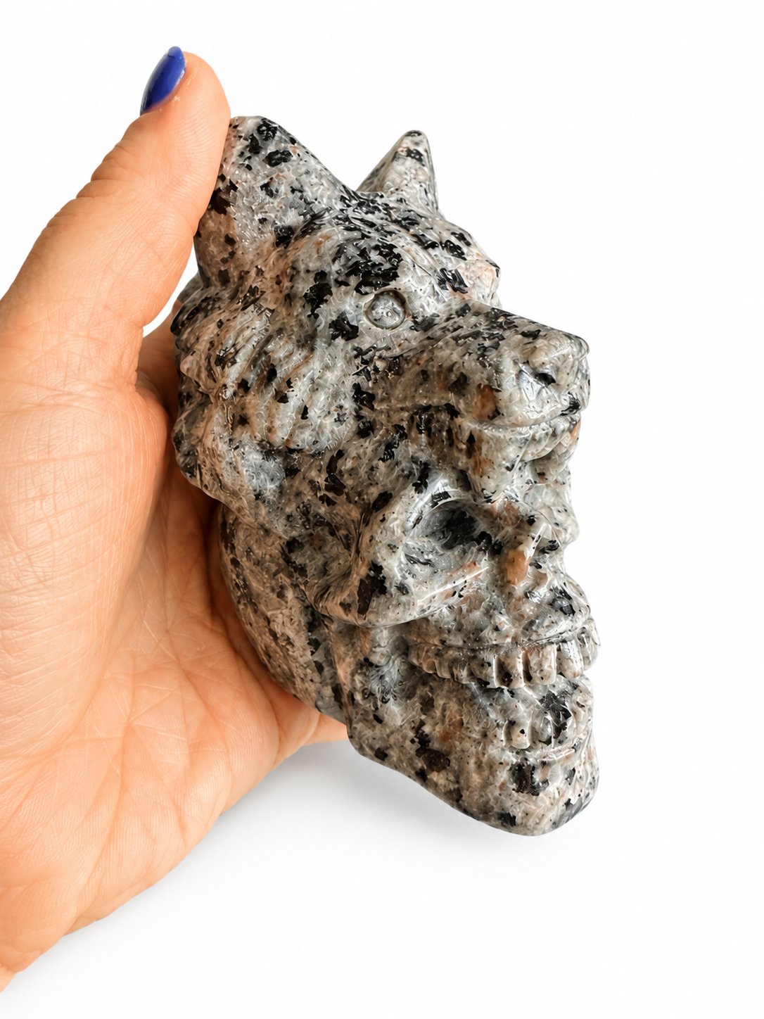 Yooperlite natural crystal skull with wolf on its head carving