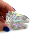 Aura coated clear quartz dinosaur skull carving