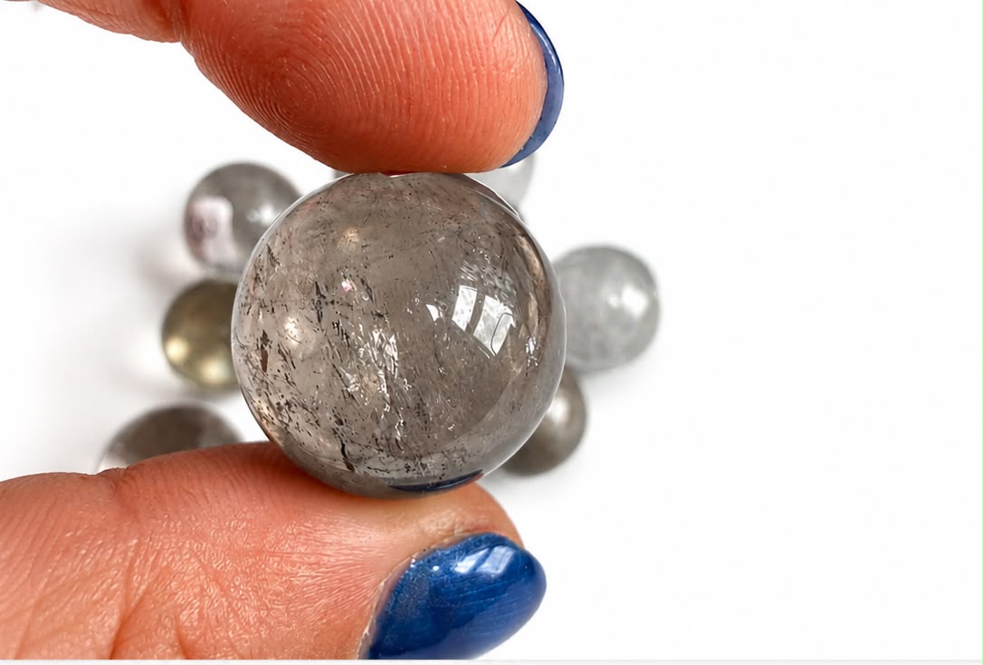 High-quality smoky￼ quartz mini spheres.